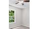 Bedroom with a window, ceiling fan, neutral walls, and neutral carpeting at 35 Ravenwood Dr, Rockmart, GA 30153