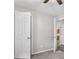 Bedroom with neutral walls, carpeting, and white doors is bathed in natural light at 35 Ravenwood Dr, Rockmart, GA 30153