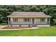 Charming home with a covered front porch, gray trim, and a well-manicured lawn at 35 Ravenwood Dr, Rockmart, GA 30153