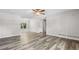 Spacious living room with laminate flooring, a window, and neutral paint at 35 Ravenwood Dr, Rockmart, GA 30153