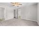 Spacious main bedroom with a neutral color palette, carpet, and a ceiling fan at 35 Ravenwood Dr, Rockmart, GA 30153