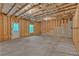 Unfinished basement ready for customization, featuring a walkout door and natural light at 7449 Waterview Cv, Douglasville, GA 30135