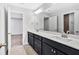 Bathroom featuring a double vanity, neutral walls, and tile flooring at 7449 Waterview Cv, Douglasville, GA 30135