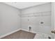 Laundry room featuring tile floors and utility sink at 7449 Waterview Cv, Douglasville, GA 30135