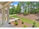 Inviting front porch with white columns and professional landscaping, enhancing the curb appeal at 7449 Waterview Cv, Douglasville, GA 30135