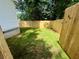 Spacious backyard featuring a lawn and new wood privacy fence at 1090 Coleman Sw St, Atlanta, GA 30310