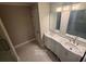 Main en suite features a dual vanity with Carrara marble top, offering both style and functionality at 1090 Coleman Sw St, Atlanta, GA 30310