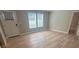 Bright and airy living room features modern wood flooring, complemented by abundant natural light through the windows at 1090 Coleman Sw St, Atlanta, GA 30310