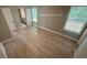A light-filled main bedroom featuring light wood floors, and an en suite bathroom at 1090 Coleman Sw St, Atlanta, GA 30310