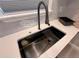 Modern kitchen featuring a waterfall sink with an automatic temperature control and custom accessories at 1090 Coleman Sw St, Atlanta, GA 30310