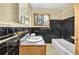 Bathroom featuring a vanity and black and white tile at 2991 Monterey Drive Dr, Decatur, GA 30032