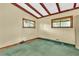 Bedroom featuring green carpet and a ceiling with wooden beams at 2991 Monterey Drive Dr, Decatur, GA 30032