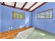 Bedroom with blue walls, green carpet, and hardwood floors at 2991 Monterey Drive Dr, Decatur, GA 30032