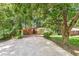 Attractive single-story home with a carport, brick accents, and lush landscaping at 2991 Monterey Drive Dr, Decatur, GA 30032