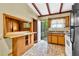 Functional kitchen space with retro tiling and a pass-through to another room at 2991 Monterey Drive Dr, Decatur, GA 30032