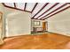 Spacious living room featuring hardwood floors, high ceilings, and wooden ceiling beams at 2991 Monterey Drive Dr, Decatur, GA 30032
