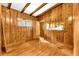 Living room showcases wood walls and hardwood floors, blending rustic charm and character at 2991 Monterey Drive Dr, Decatur, GA 30032