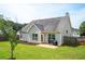 Spacious backyard with green lawn, a patio, and a well-maintained fence at 4776 Harrod Ct, Douglasville, GA 30135