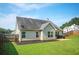 Lush backyard with a well-kept lawn, patio area, and privacy fence at 4776 Harrod Ct, Douglasville, GA 30135
