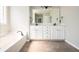Bright bathroom with double vanity, a large mirror, and neutral decor at 4776 Harrod Ct, Douglasville, GA 30135