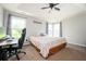 Inviting bedroom with tray ceiling, ample natural light, and neutral decor at 4776 Harrod Ct, Douglasville, GA 30135