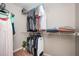 Well-organized walk-in closet with ample shelving and hanging space for clothes and accessories at 4776 Harrod Ct, Douglasville, GA 30135