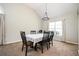 Inviting dining space with neutral walls, chandelier, and large window providing natural light at 4776 Harrod Ct, Douglasville, GA 30135