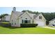 Charming home with neutral siding, well-manicured lawn, and an attached two-car garage at 4776 Harrod Ct, Douglasville, GA 30135