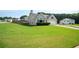 Spacious front yard and well-maintained landscaping enhance the curb appeal of this suburban home at 4776 Harrod Ct, Douglasville, GA 30135