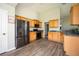 Modern kitchen featuring stainless steel appliances, wooden cabinetry, and sleek countertops at 4776 Harrod Ct, Douglasville, GA 30135
