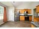 Well-equipped kitchen features stainless steel appliances, wood cabinets, and a modern aesthetic at 4776 Harrod Ct, Douglasville, GA 30135