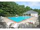 Refreshing community pool surrounded by lounge chairs and lush greenery at 4776 Harrod Ct, Douglasville, GA 30135