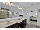 Stylish bathroom boasts double sinks, modern fixtures, and a shower adjacent to a bedroom at 611 Sugar Prairie Bnd, Lawrenceville, GA 30045