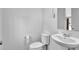 Clean half-bathroom with a modern sink and toilet, perfect for guests at 611 Sugar Prairie Bnd, Lawrenceville, GA 30045