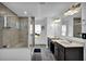 Modern bathroom with a glass-enclosed shower and double sinks with dark wood cabinetry at 611 Sugar Prairie Bnd, Lawrenceville, GA 30045