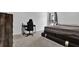 Bedroom area includes a study desk and chair near the window and neutral walls at 611 Sugar Prairie Bnd, Lawrenceville, GA 30045