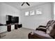 Bonus room with media center and a comfortable reclining chair at 611 Sugar Prairie Bnd, Lawrenceville, GA 30045