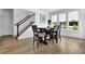 Open dining area with hardwood floors, with natural lighting from windows at 611 Sugar Prairie Bnd, Lawrenceville, GA 30045
