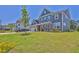 Two-story home with a manicured lawn and a paved driveway at 611 Sugar Prairie Bnd, Lawrenceville, GA 30045
