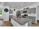 Eat-in kitchen island with granite countertops and stainless steel appliances at 611 Sugar Prairie Bnd, Lawrenceville, GA 30045