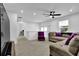 Upstairs loft area featuring neutral carpet, white walls, windows, and comfortable seating area at 611 Sugar Prairie Bnd, Lawrenceville, GA 30045