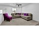 Cozy upstairs loft featuring neutral carpet, white walls, windows, and comfortable seating area at 611 Sugar Prairie Bnd, Lawrenceville, GA 30045