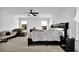 Spacious main bedroom with neutral decor, carpet flooring, and large windows at 611 Sugar Prairie Bnd, Lawrenceville, GA 30045