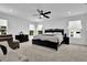 Bright main bedroom with plenty of natural light, neutral paint, and carpet at 611 Sugar Prairie Bnd, Lawrenceville, GA 30045