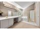 Bright bathroom featuring a tub, separate shower, dual sinks, and ample counter space at 1095 Northpoint Trce, Roswell, GA 30076