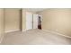Bedroom featuring neutral walls, plush carpet flooring, and doorways that enhance flow and space at 1095 Northpoint Trce, Roswell, GA 30076