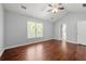 Vaulted bedroom features hardwood floors, a ceiling fan, and a window for natural lighting at 1095 Northpoint Trce, Roswell, GA 30076