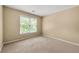 Neutral bedroom with window and carpet floors, ready for personalization and comfort at 1095 Northpoint Trce, Roswell, GA 30076