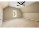 Upstairs bedroom featuring carpeting, a window, and ample closet space at 1095 Northpoint Trce, Roswell, GA 30076