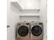 Laundry room featuring modern front load washer and dryer at 1095 Northpoint Trce, Roswell, GA 30076